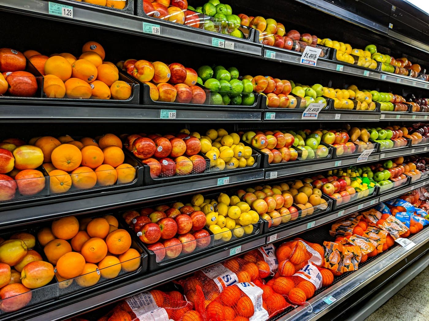 Well-stocked shelves of fruit in a shop